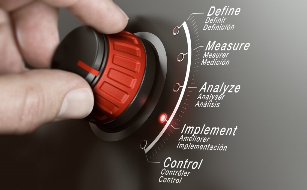 Hand Turning dial to represent Processes Improvements after Lean manufacturing consulting services.