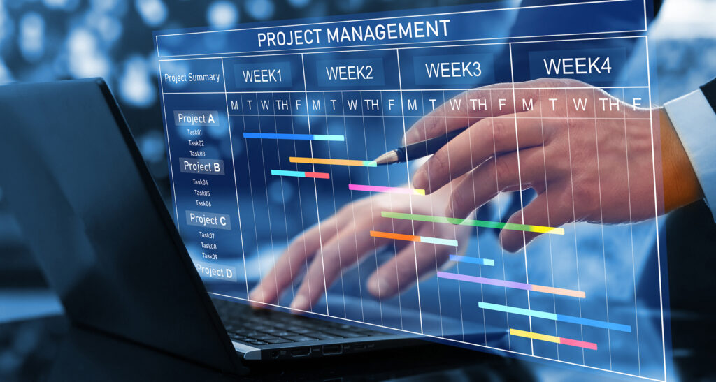 Project manager updating tasks and milestones progress planning with Gantt chart scheduling